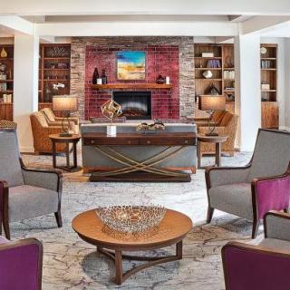 A cozy living room with a fireplace and comfortable seating arrangements.