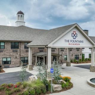 A welcoming entrance of The Landing, featuring well-maintained landscaping and modern architecture.
