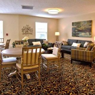 A cozy living room with comfortable seating and elegant decor.