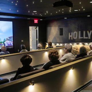 An audience enjoying a film in a modern movie theater.