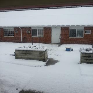 A residential building blanketed in snow during winter.