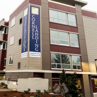 A modern apartment building with a sign reading 'Cornell Landing'.