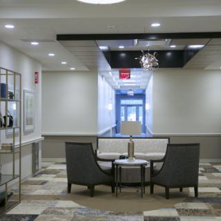 A modern lobby interior with comfortable seating and stylish lighting.