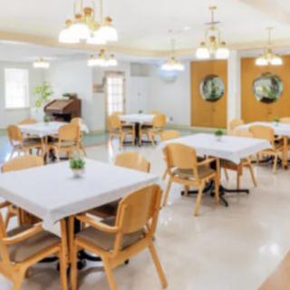 A bright and welcoming dining room with tables and chairs neatly arranged.