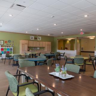 Spacious dining area with neatly arranged tables and chairs.