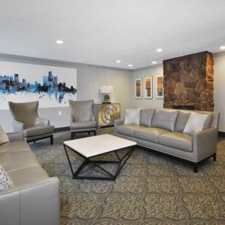 A modern living room with stylish furniture and contemporary artwork on the walls.