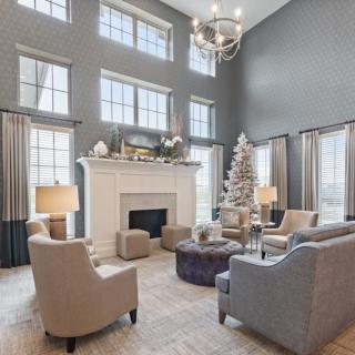 Elegant living room with modern decor and a festive touch.