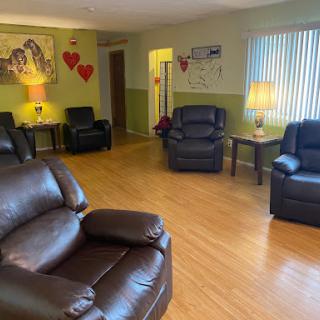 A cozy living room featuring comfortable recliners and warm lighting.