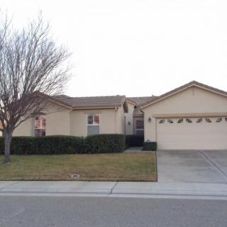 A suburban house with a two-car garage and a small front yard.