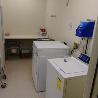 A functional laundry room featuring a washing machine and dryer.