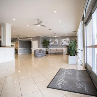 A spacious and modern lobby area with bright lighting and contemporary furnishings.