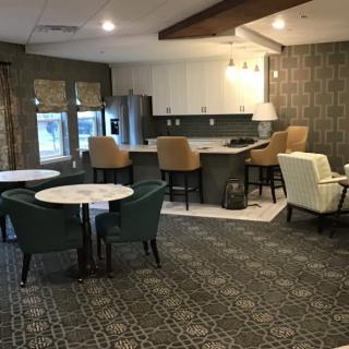 A modern open-concept living room and kitchen with stylish furniture and decor.