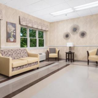 A well-lit waiting room with comfortable seating and modern decor.
