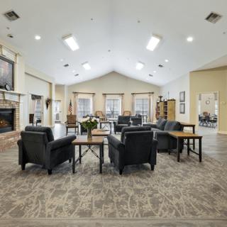 A spacious lobby with multiple seating areas and a fireplace.