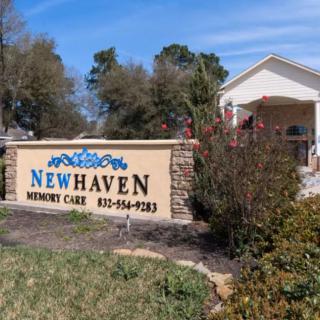 Entrance to Newhaven Memory Care facility with surrounding landscaping.