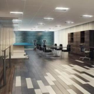 A modern office space with a conference area and stylish interior design.