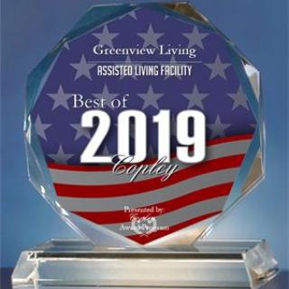 A glass award titled 'Best of 2019' featuring an American flag design.