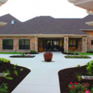 A landscaped courtyard entrance of a building.