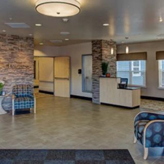 A modern and welcoming lobby area with comfortable seating and a reception desk.