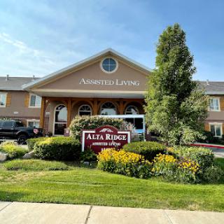 Entrance of Alta Ridge Senior Living facility, featuring well-kept landscaping and signage.