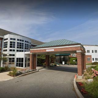 Front entrance of a modern hospital building.