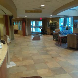 Spacious lobby area with seating and reception desk.