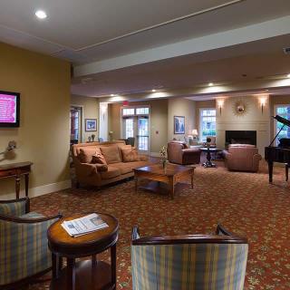 A cozy lounge area with comfortable seating and a television.