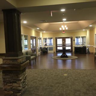 A modern lobby space featuring comfortable seating, warm lighting, and an inviting atmosphere.