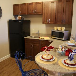 A cozy kitchen setup with dining area and modern appliances.