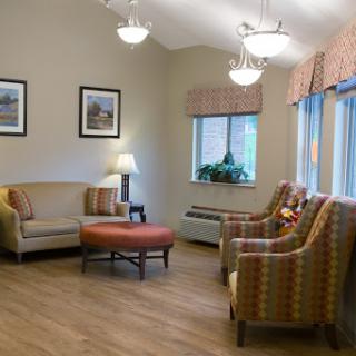 A cozy living room setup with comfortable seating and natural light.