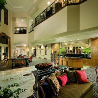 A luxurious and spacious living room with modern decor and an open floor plan.