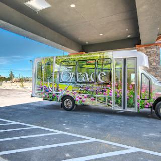 A vibrant food truck parked in a modern urban area.
