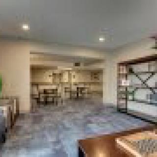 A modern open-plan living area with stylish furnishings and decor.