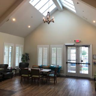 A welcoming lobby area featuring ample natural light and comfortable seating.