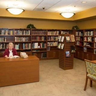 A cozy library with bookshelves and reading areas.