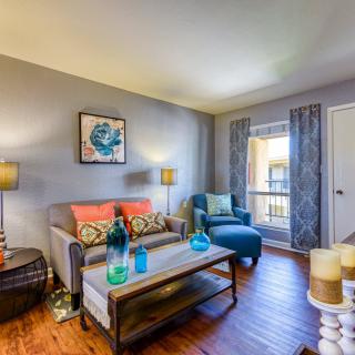 A modern living room with colorful accents and stylish furnishings.