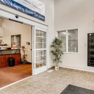 A welcoming office lobby with a reception area and mailboxes.