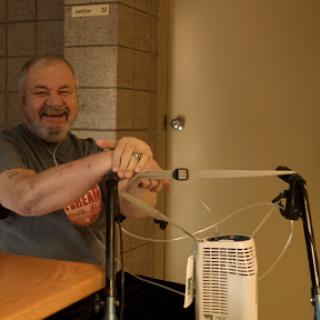 A person enjoying a light-hearted moment indoors.