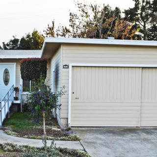 A suburban house with a garage and driveway.