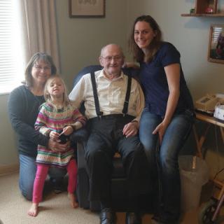 A warm family moment capturing three generations together.