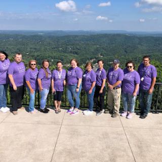 A team enjoying a sunny day with a beautiful scenic view.