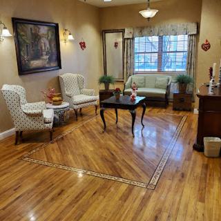 A cozy living room featuring stylish furniture and warm wooden flooring.
