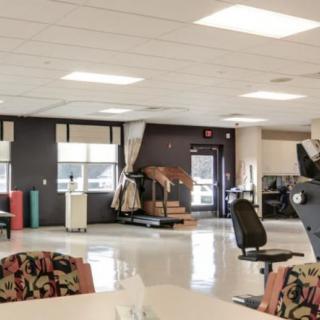 A well-lit office space with furniture and equipment.