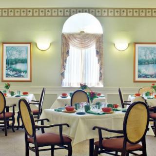 Elegant dining area with neatly arranged tables and classic decor.