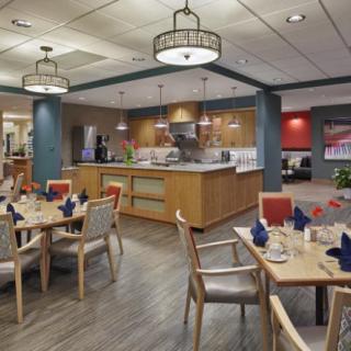A cozy restaurant dining area with neatly arranged tables and ambient lighting.