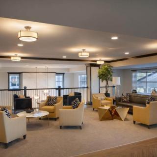 A modern lounge area with stylish seating and ambient lighting.