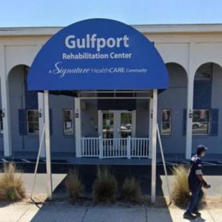 Entrance of Gulfport Rehabilitation Center with signage.