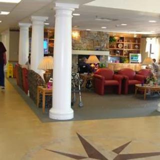 A cozy hotel lobby featuring comfortable seating and decorative elements.