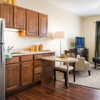 Cozy apartment with a small kitchen and living area.