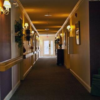A well-lit hallway with decorative elements on the walls.